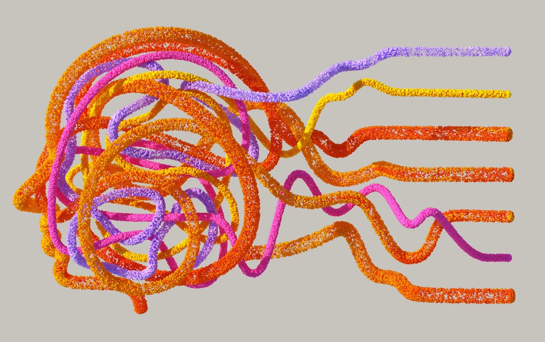 Colorful abstract representation of tangled lines symbolizing chaotic and repetitive thoughts.
